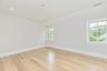 Unfurnished room with light wood-style flooring, recessed lighting, and lofted ceiling