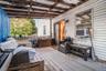 Wooden terrace featuring cooling unit