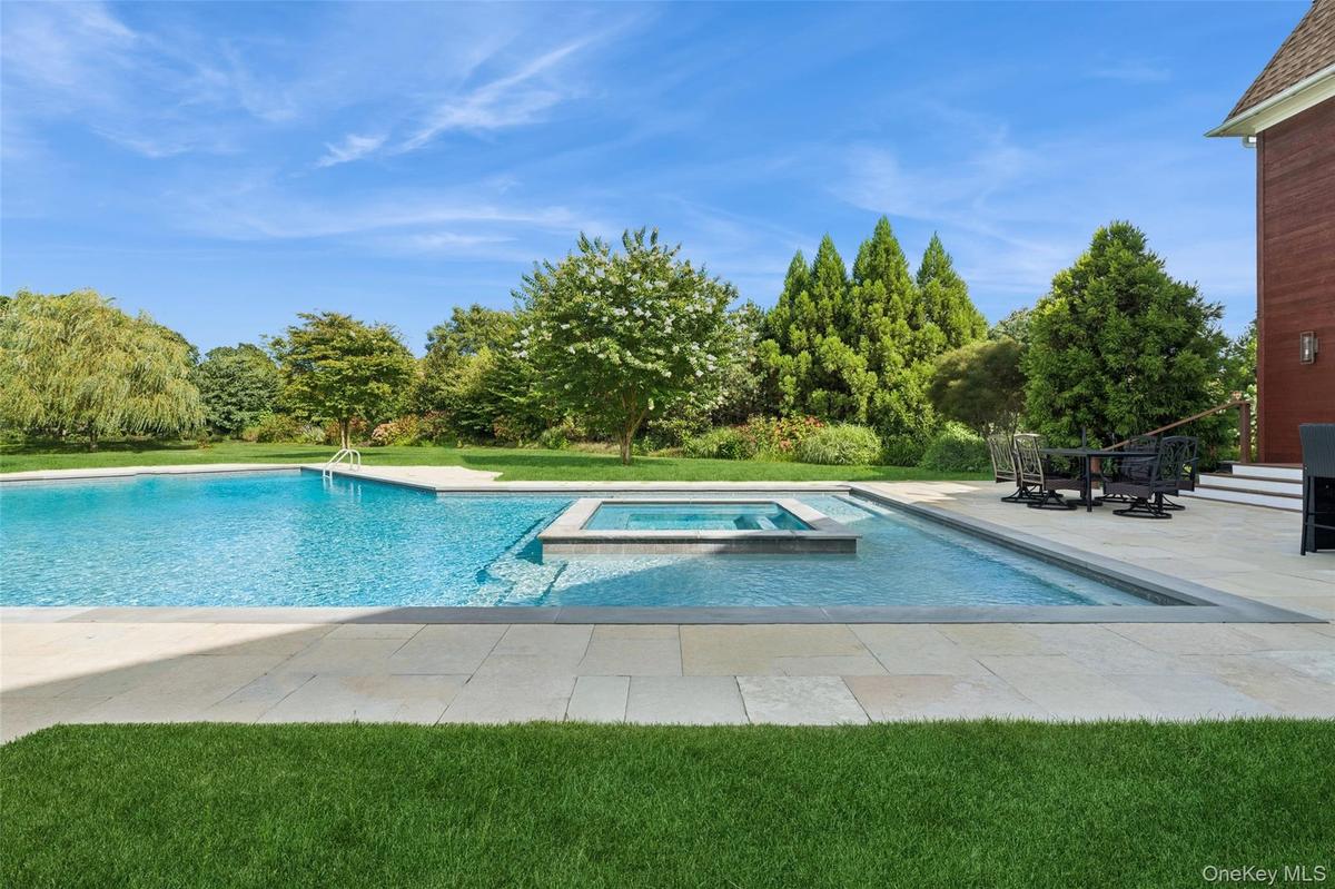 On a super private one acre lot with gunite heated pool