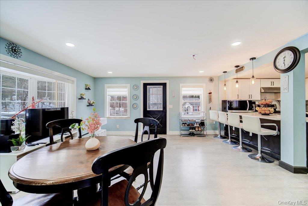 Step into a home where the entrance unfolds into a stunning, open-concept kitchen.