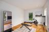 Exercise area featuring baseboards, wood finished floors, and recessed lighting