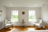 Sitting room with wood finished floors, recessed lighting, and baseboards