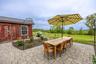 View of patio / terrace featuring outdoor dining space and an outdoor structure