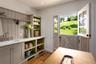 Laundry Room featuring wood finished floors, a sink, and recessed lighting