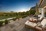 Fenced backyard with a patio and outdoor lounge area