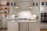 Kitchen with appliances with stainless steel finishes, light wood finished floors, decorative backsplash, open shelves, and glass insert cabinets