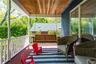 Inviting Covered Front Porch with Courtship Swing