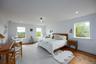 Bedroom with wood finished floors, recessed lighting, and baseboards