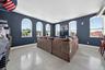 Living room featuring concrete floors and baseboards