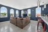 Living room with concrete floors and baseboards