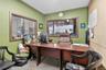Home office featuring concrete floors