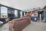 Living room with finished concrete floors and baseboards