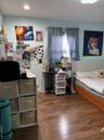 Bedroom featuring dark wood-type flooring