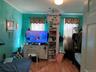 Bedroom featuring wood finished floors and ornamental molding