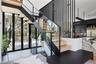 Floating Stair Detail – Sculptural steel, glass and oak stairs add a signature architectural moment