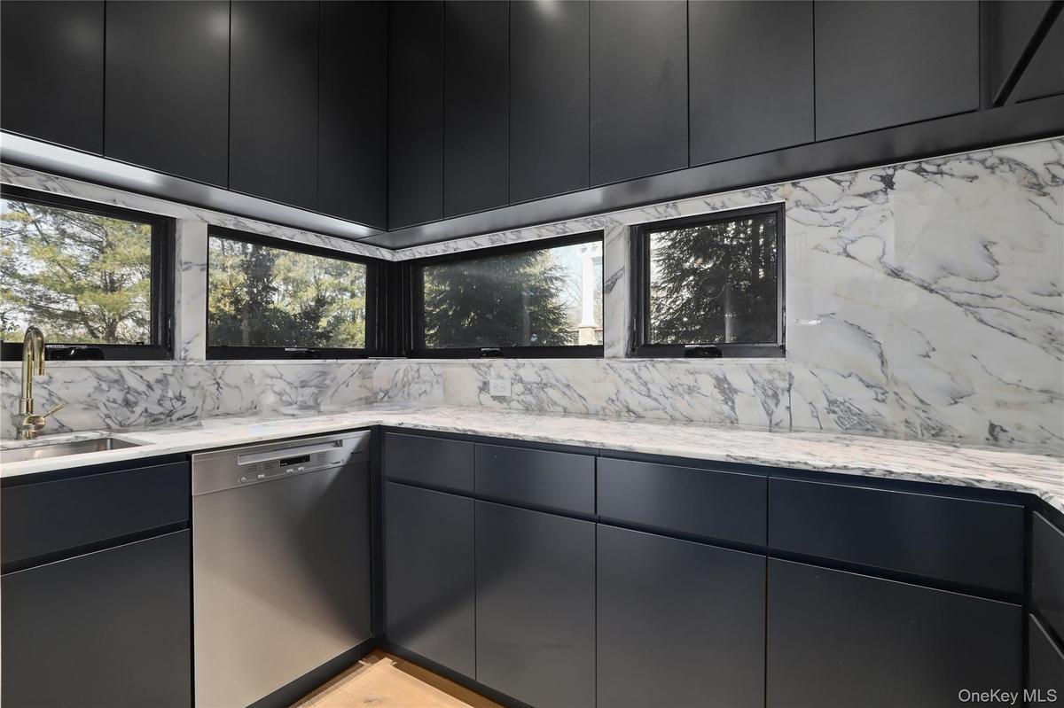 Butler’s Pantry – Fully outfitted prep pantry with sink, storage, and added appliances.