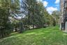 Peaceful outdoor private setting with mature trees and green space