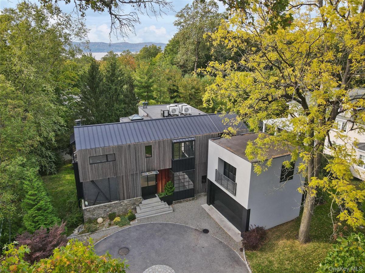 Serene setting among mature trees, minutes to Irvington village, the Hudson River and Metro-North