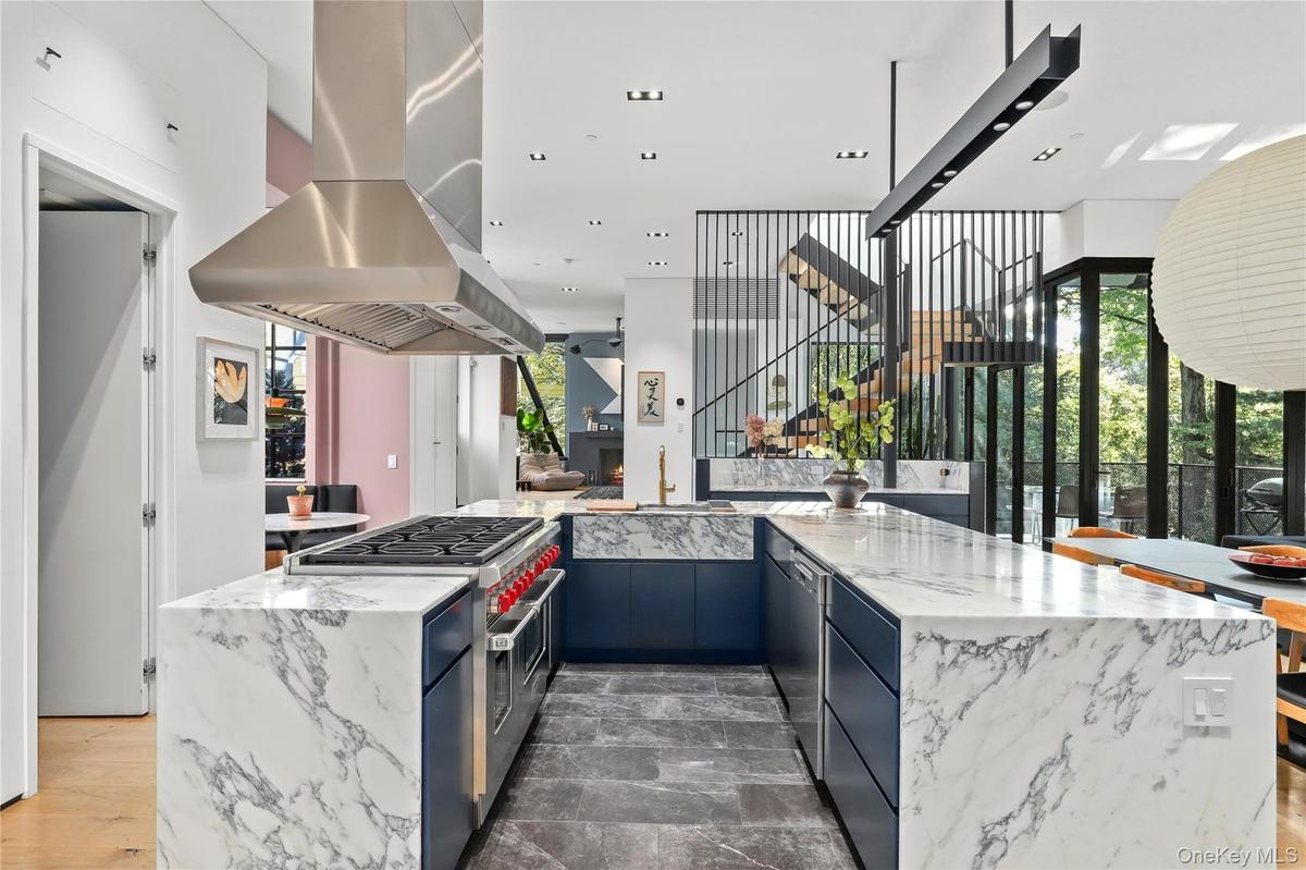 Kitchen / Appliances – Professional-grade Wolf range and Sub-Zero refrigeration.