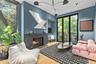 Primary Sitting Area – Cozy lounge with fireplace and refined modern finishes.