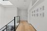 Upper Landing Gallery - skylit hallway adds volume, light and architectural detail.