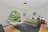 Primary Bedroom – Spacious retreat with fireplace and peaceful outlook.