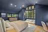 Designer Bedroom – Moody color, oversized windows with modern lines.