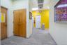 Hall with a paneled ceiling and wood finished floors