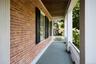 Covered porch with a sunroom
