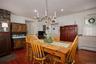 Dining area with dark wood finished floors, a chandelier, recessed lighting, and a baseboard radiator