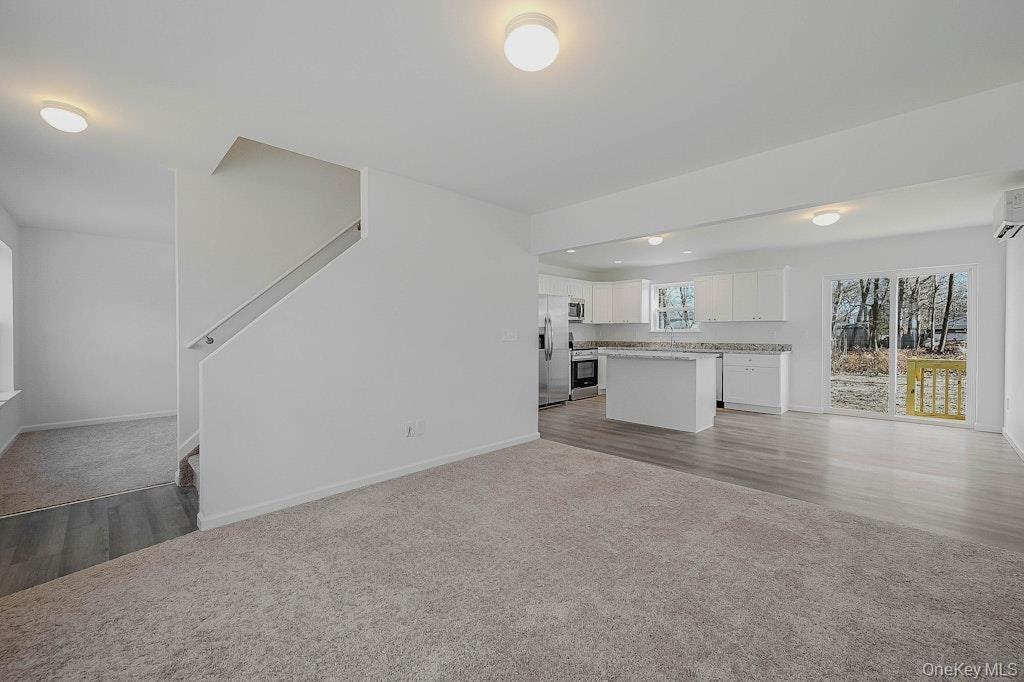 Living room shows with carpet from a different location