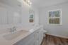Bathroom featuring double vanity