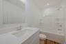 Full bathroom with vanity, shower / tub