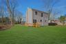 Back of house featuring a wooden deck