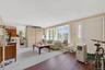 Living room featuring wood finished floors and a baseboard radiator