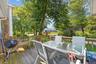 Deck with outdoor dining space and grilling area