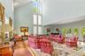 Stunning Great room with soaring ceilings, herringbone wood floors, doors to deck