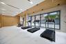 Workout area featuring wooden walls and marble finish floors