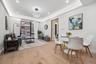 Dining area featuring light wood-style flooring, recessed lighting, a wall of windows, and baseboards