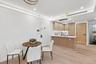 Dining room with light wood finished floors and recessed lighting