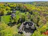View from above of property with a heavily wooded area