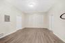 Unfurnished room featuring electric panel and light wood finished floors