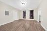 Unfurnished room featuring electric panel and light wood finished floors