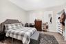 Bedroom with light wood-style floors and baseboards