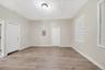 Entrance foyer with light wood-style floors and electric panel