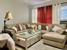 Living room with ornamental molding and cooling unit