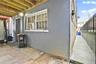 View of home's exterior featuring stucco siding and fence