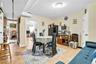 Dining area with light tile patterned floors