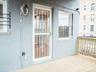 View of exterior entry with stucco siding