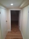 Hall featuring light wood-style flooring and recessed lighting